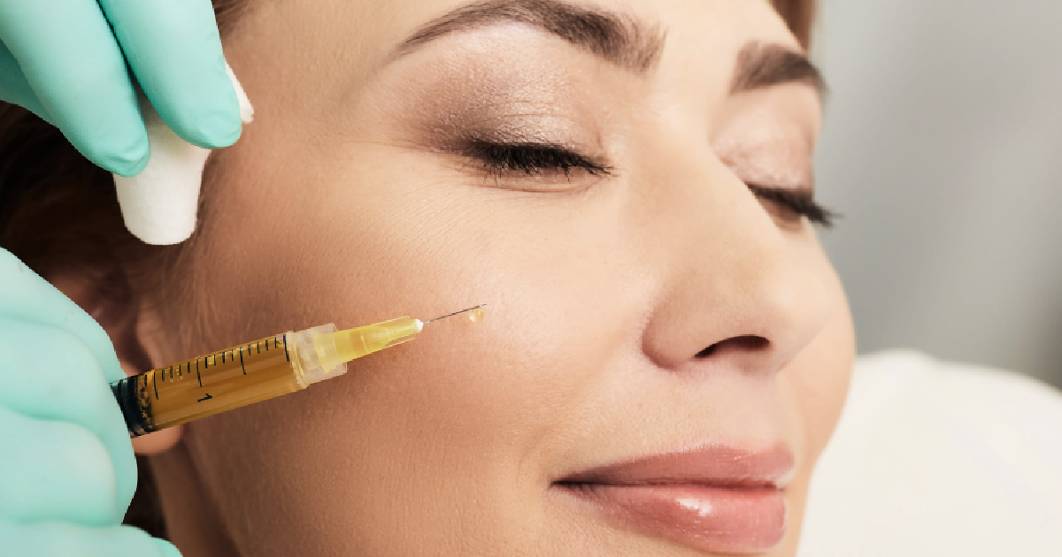 Woman receiving a PRP Therapy facial injection in the cheek area, with a medical professional in Savannah, GA